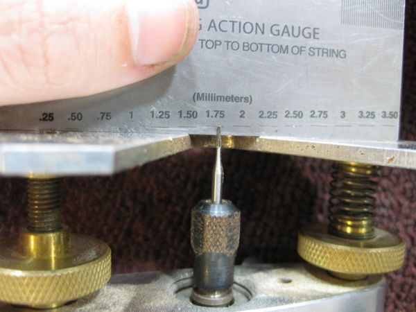 Using a Dremel tool to clean and refine the fret slots after fret removal