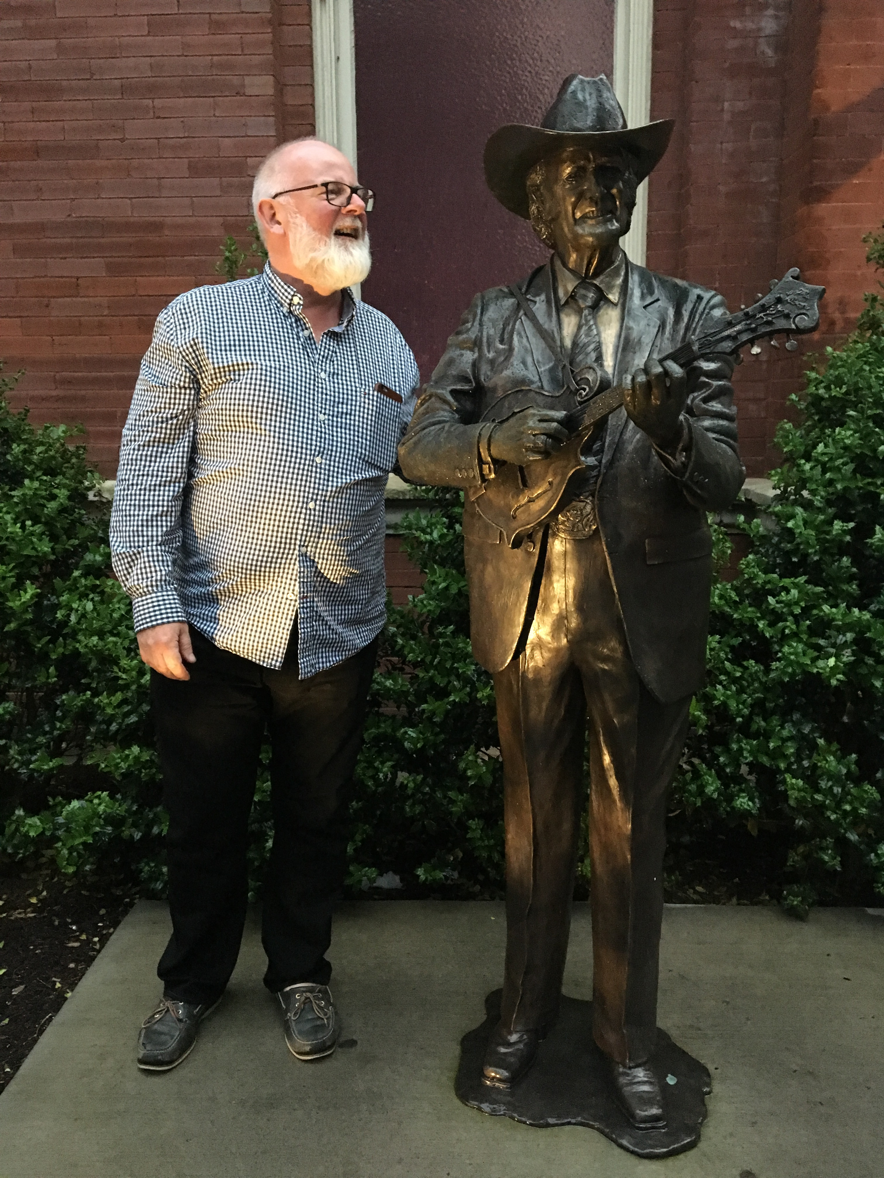 Bronze statue of Bill Monroe with his mandolin at the Ryman Auditorium