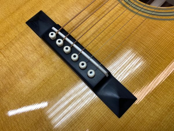 Original right-handed acoustic guitar bridge saddle