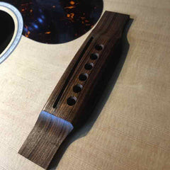 Hydrating the guitar bridge with lemon oil