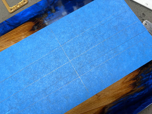 Close-up of the routing template and router bit engaged in cutting the neck pocket into the epoxy guitar body, ensuring precise dimensions.