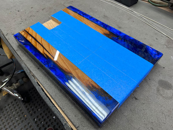View of the guitar body with the neck temporarily placed in the newly routed neck pocket, checking for fit and alignment before proceeding.