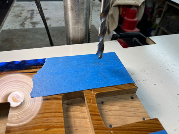 Side view of the epoxy block showing its thickness and density, illustrating the material challenges in crafting this unique guitar body.