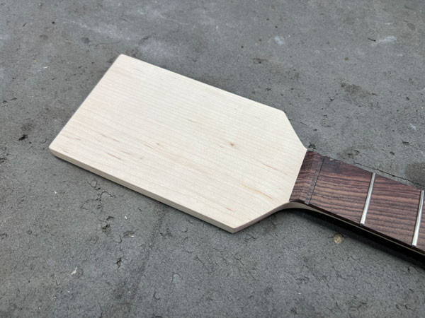 Selection of reclaimed cypress wood, sourced from an old New Orleans porch column, to be used for the guitar headstock veneer.