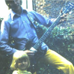 Young bass player with a Columbus EB3 copy bass guitar, reminiscent of early Gibson EB basses.
