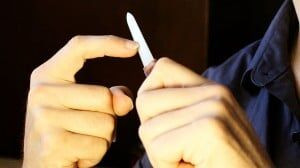 Shaping classical guitar nails with a file