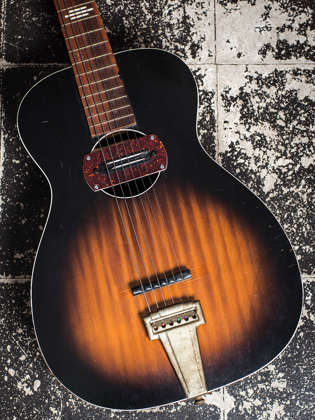 A modified Harmony-made Stella parlor acoustic guitar with a rubber bridge, displayed at Old Style Guitar Shop in Los Angeles