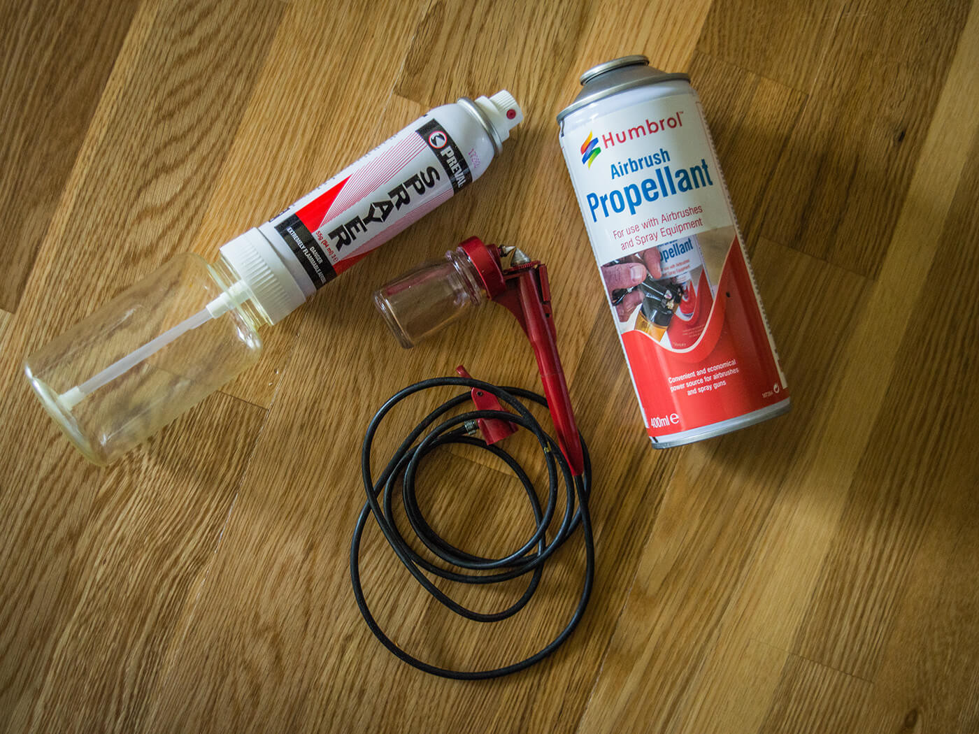The Preval sprayer is used for the aniline yellow and the airbrush is used for shading the edges and applying the aniline red