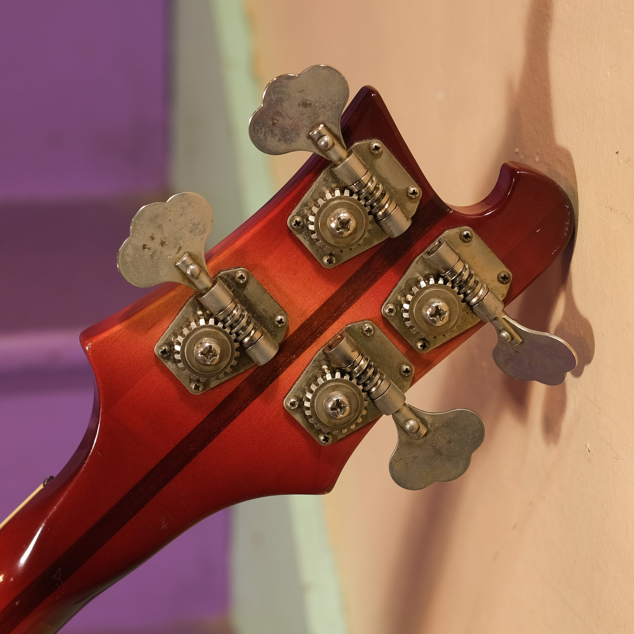 Image of the Rickenbacker 4001 bass guitar leaning against an amplifier, suggesting its readiness for performance
