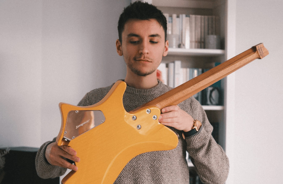 Connor Kaminski demonstrating 7-string guitar techniques and explaining the benefits of Drop A tuning for easy power chords.