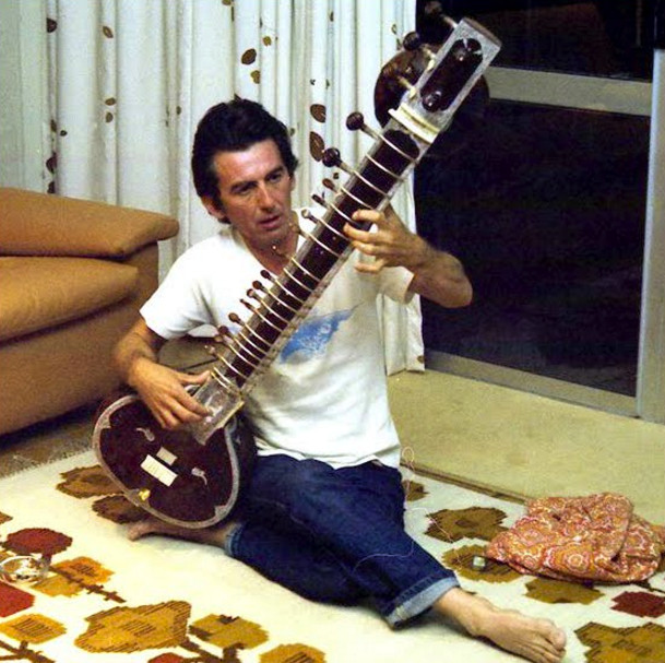 George Harrison with a sitar, an instrument he popularized in Western music