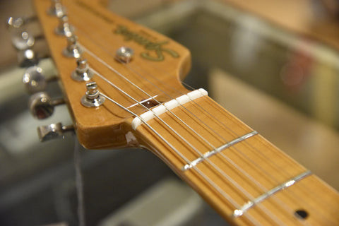The plastic nut on a Squier Classic Vibe Stratocaster