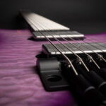 Strandberg Boden Prog NX 7 string headless guitar in Twilight Purple, showcasing its ergonomic design and extended range capabilities.