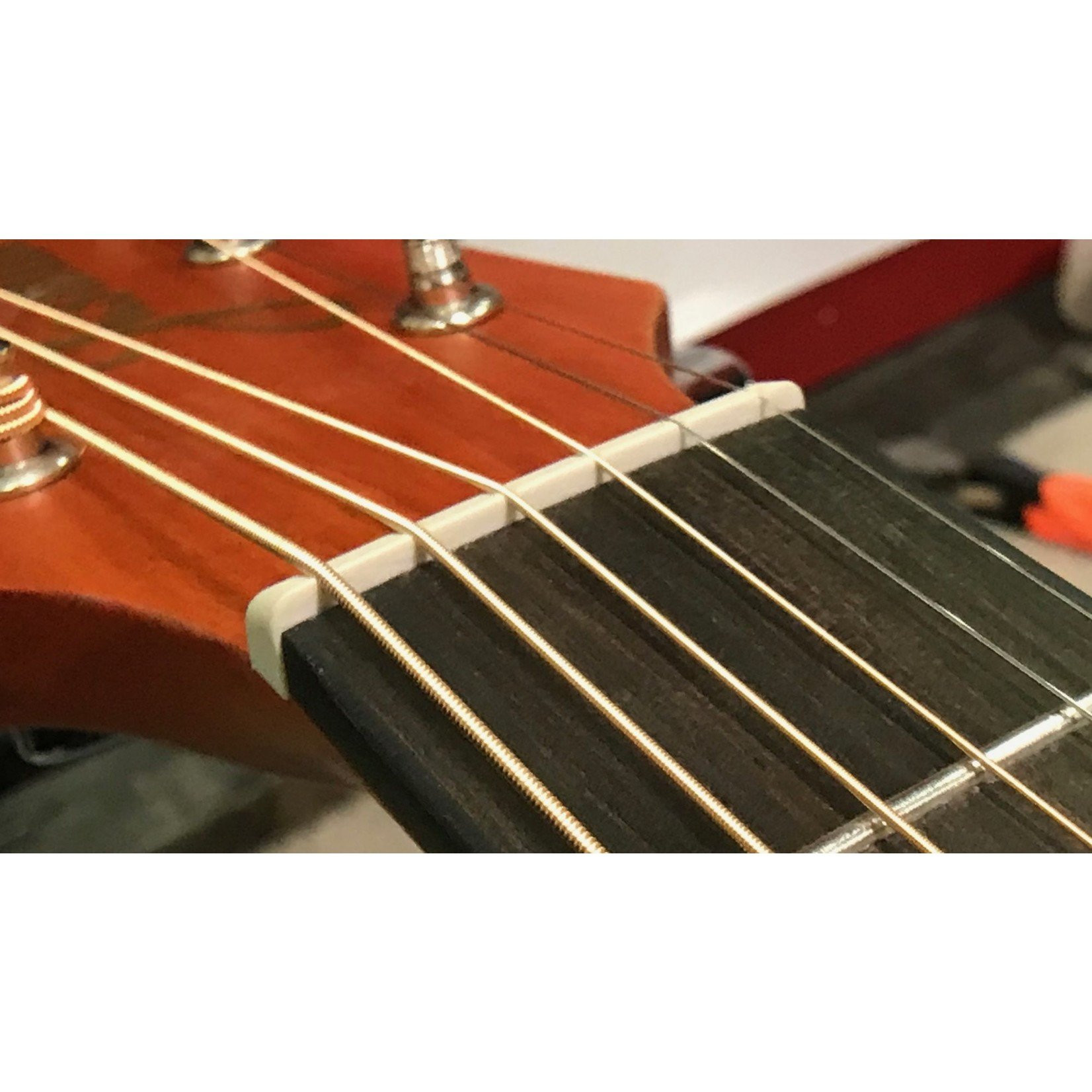 Close-up of Jasmine S35 headstock and strings