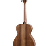 Taylor AD12e-SB grand concert acoustic guitar back view showing walnut wood grain.