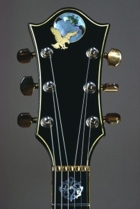 Headstock of the Tiger Guitar with eagle inlay