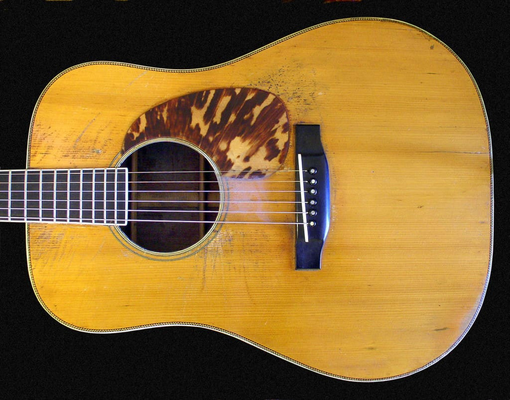 The top of Tony Rice's 1935 Martin D-28 guitar, showcasing its aged spruce and modifications