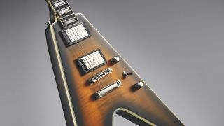 Angled shot of a yellow Epiphone Prophecy Flying V electric guitar