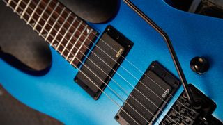 EMG pickups installed on a Jackson guitar, showcasing a common brand and guitar pairing for metal music