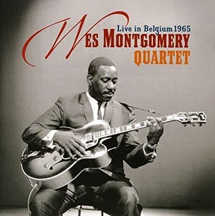 Close-up of Wes Montgomery's sunburst Gibson L5-CES guitar featuring a Venetian cutaway, single humbucker pickup, and a unique pearl heart inlay with his name, from the back cover of the &quot;Tequila&quot; album.