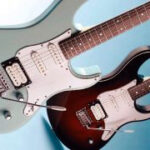Two Yamaha Pacifica 112Vs on blue background