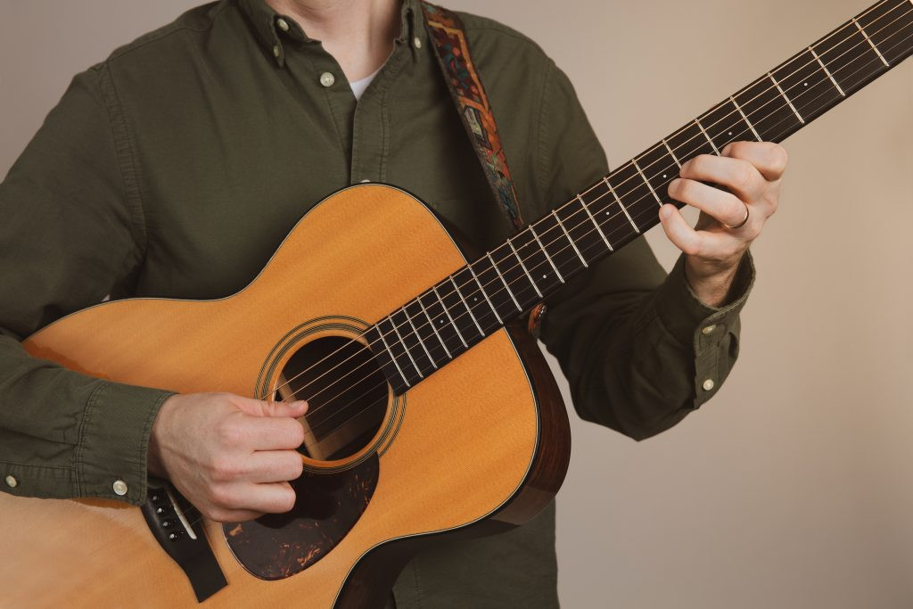 Beginner guitarists choosing between acoustic and electric guitars