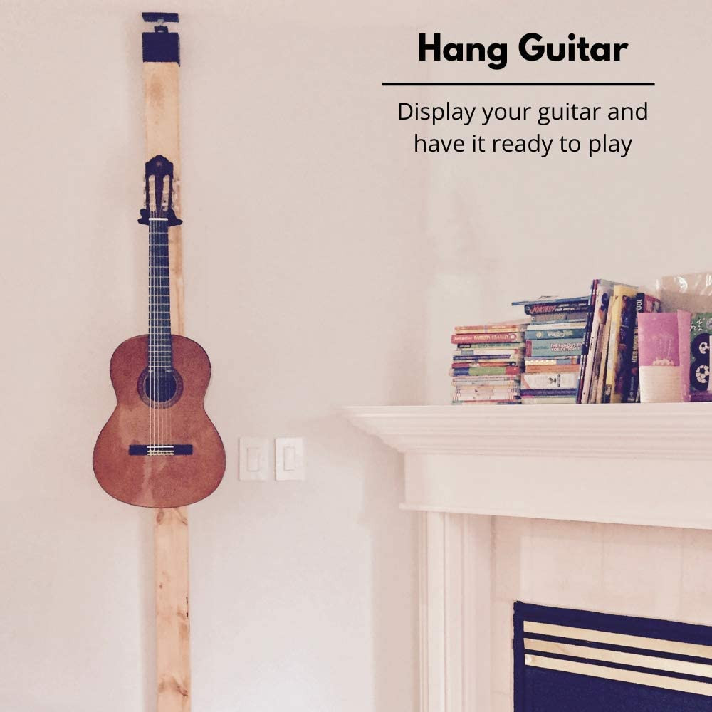 Guitar hanging on a wall with a traditional hanger