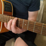 Sliding finger from 5th to 7th fret while maintaining pressure