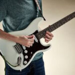Guitarist playing a solo with intensity