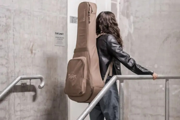 Guitar case for back carry showcasing padded straps and durable material