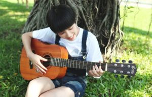 Beginner guitar player practicing basic chords