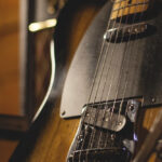 Electric guitar with amp and microphone for recording setup