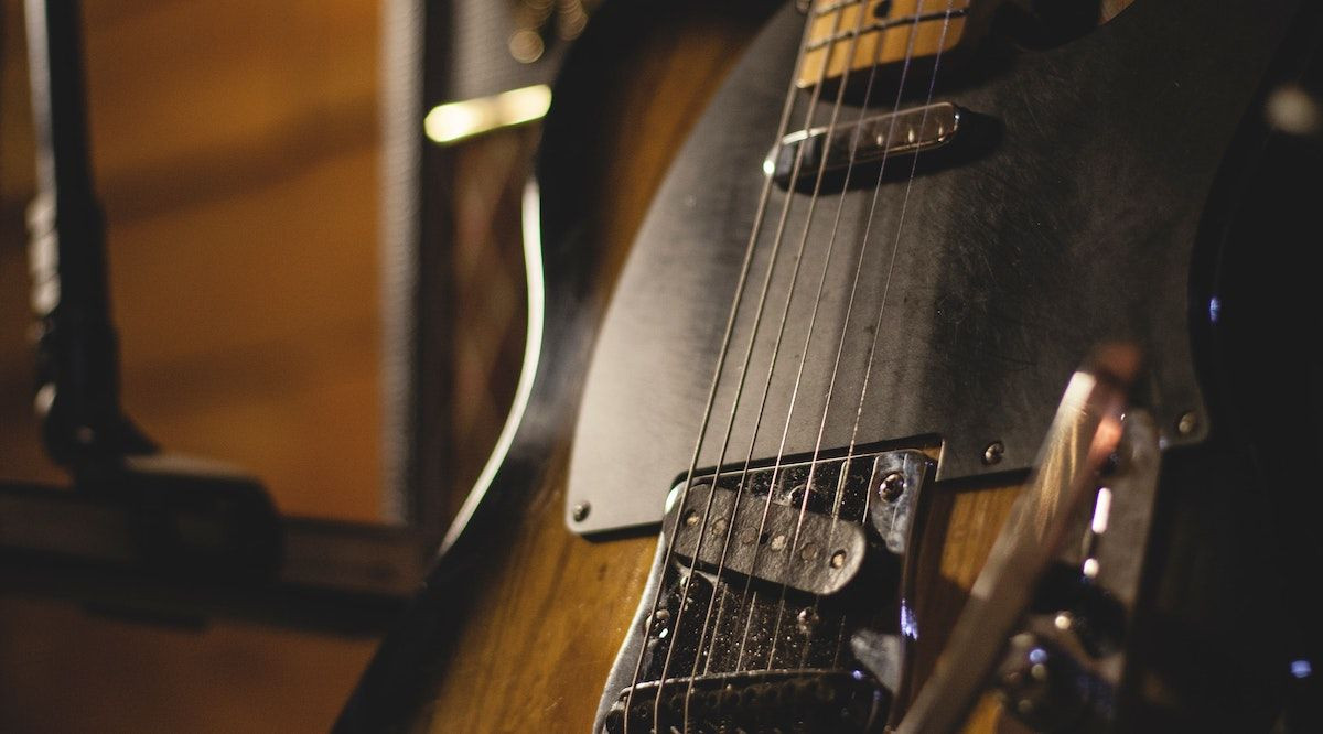 Electric guitar with amp and microphone for recording setup