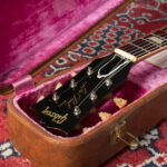 A collection of various Gibson Les Paul models, showcasing their distinct body shapes and finishes