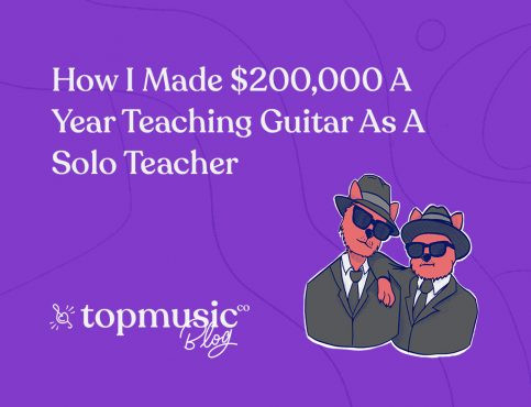 Guitar teacher demonstrating chords to student