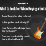 Checking the guitar neck for straightness and action.