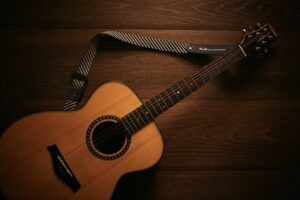 Close up of guitar frets and strings, highlighting the complexities of chord shapes