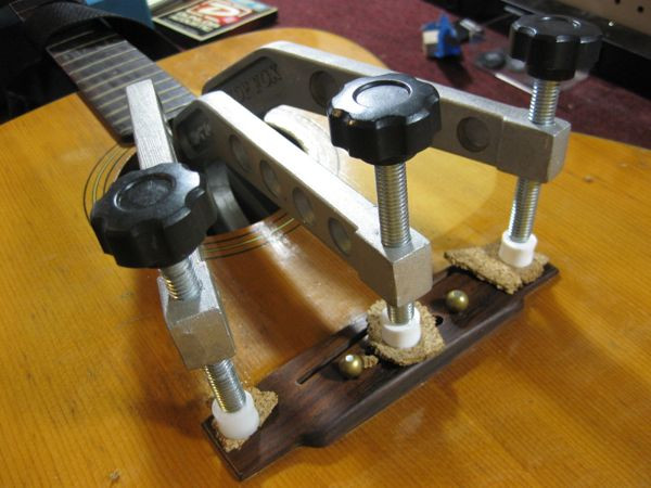 Clamping the bridge in place with bridge pins as locators