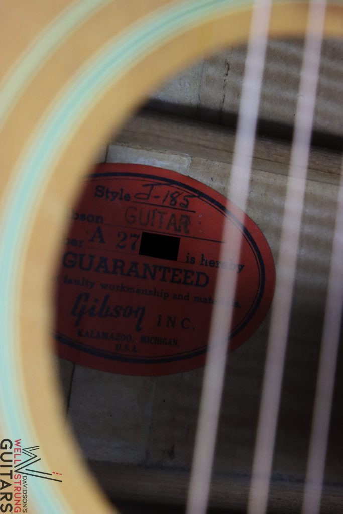 Acoustic guitar label displaying the serial number, crucial for identifying the guitar's manufacturing details
