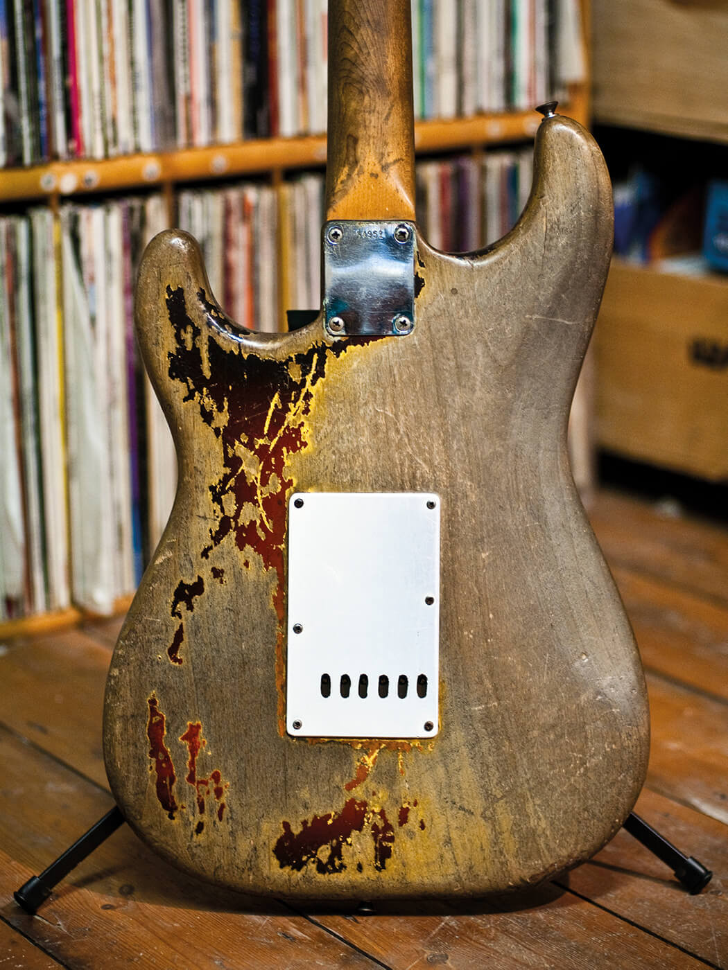 The back of Rory Gallagher's Stratocaster, showing the smooth wood and blue stain from his jeans