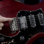 Electric guitar bridge saddles adjustment
