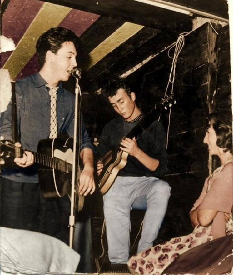John playing the Hofner Club 40 at The Casbah Coffee Club with Cynthia Lennon watching from the front row, before the Beatles existed.