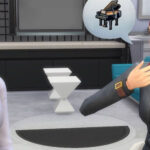 A black haired female Sim listens to a red haired female Sim talking about something she wants to learn in The Sims 4.