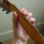 Guitar neck with proper hand positioning