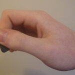 Guitar pick holding technique